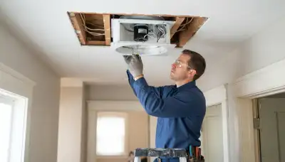 Technician installs a whole house fan ceiling unit and insulated damper in a Salt Lake City, UT home.