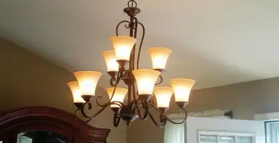Classic ceiling chandelier installation with warm lighting in Salt Lake City, UT