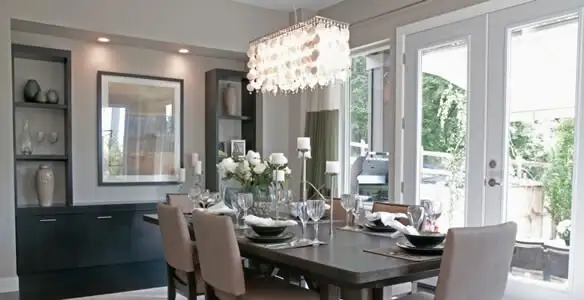 Elegant dining room chandelier installation above table in Salt Lake City, UT