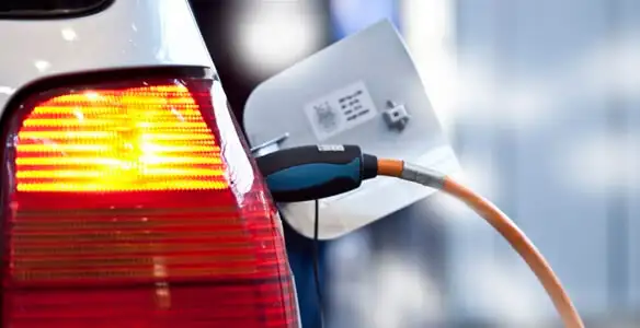 Electric car plugged into EV charger after professional installation in Salt Lake City, UT