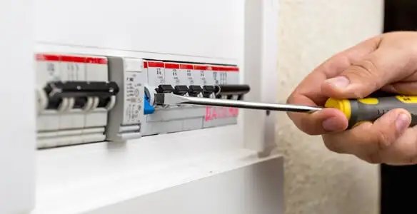 electrical panel upgrade service showing technician adjusting circuit breakers during system upgrade in Salt Lake City, UT