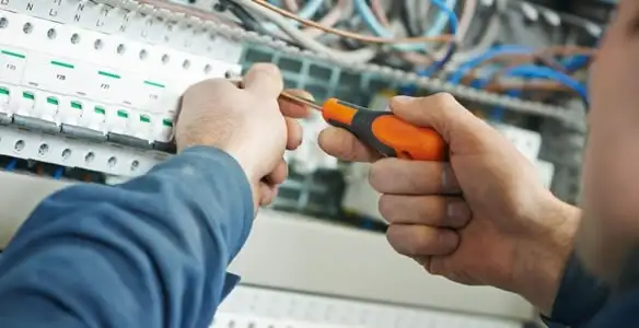electrical service showing licensed electrician performing electrical panel maintenance and adjustments in Salt Lake City, UT