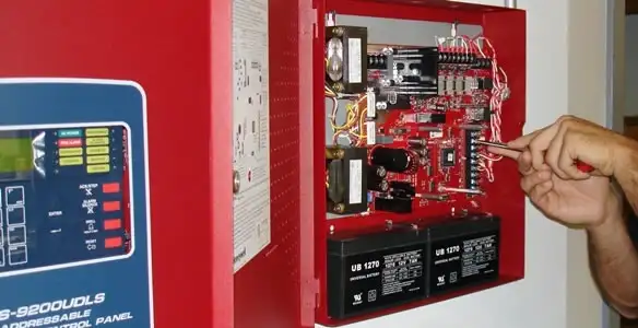 fire alarm installation service showing technician configuring fire alarm control panel in Salt Lake City, UT