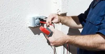Electrician performing home electrical outlet and wiring inspection in Salt Lake City, UT