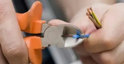 professional electrical services showing precise wire cutting by licensed electricians in Salt Lake City, UT