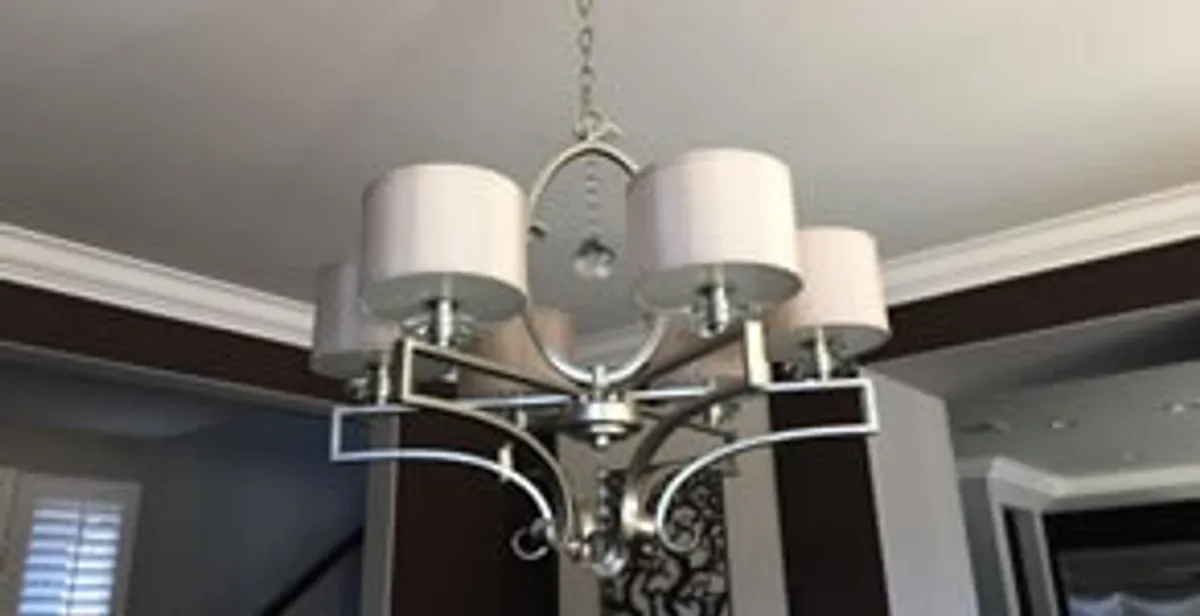 Modern chandelier installation with multiple light fixtures in Salt Lake City, UT