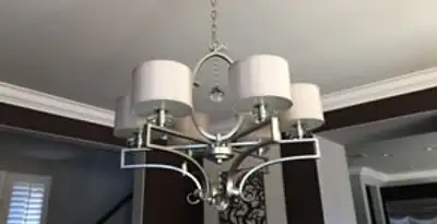 Modern chandelier installation with multiple light fixtures in Salt Lake City, UT