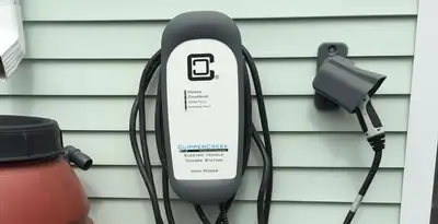 Outdoor electric vehicle charger installation on residential wall in Salt Lake City, UT