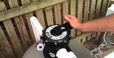 pool pumps service showing professional adjustment of pool pump control system in Salt Lake City, UT