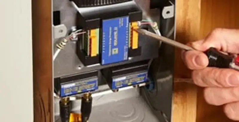 Whole home surge protection device being installed by a licensed electrician to protect electrical systems in Salt Lake City, UT